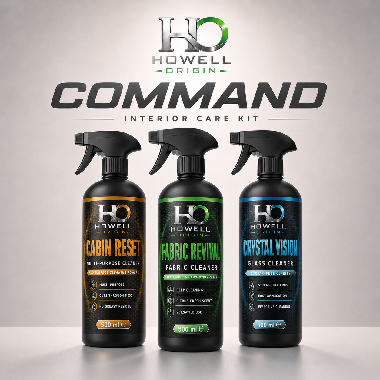 Three HO Howell Origin Command Interior Care Kit spray bottles displayed against a neutral gray background with the brand logo and product name at the top. The bottles are black with orange, green, and blue labels for Cabin Reset, Fabric Revival, and Crystal Vision.